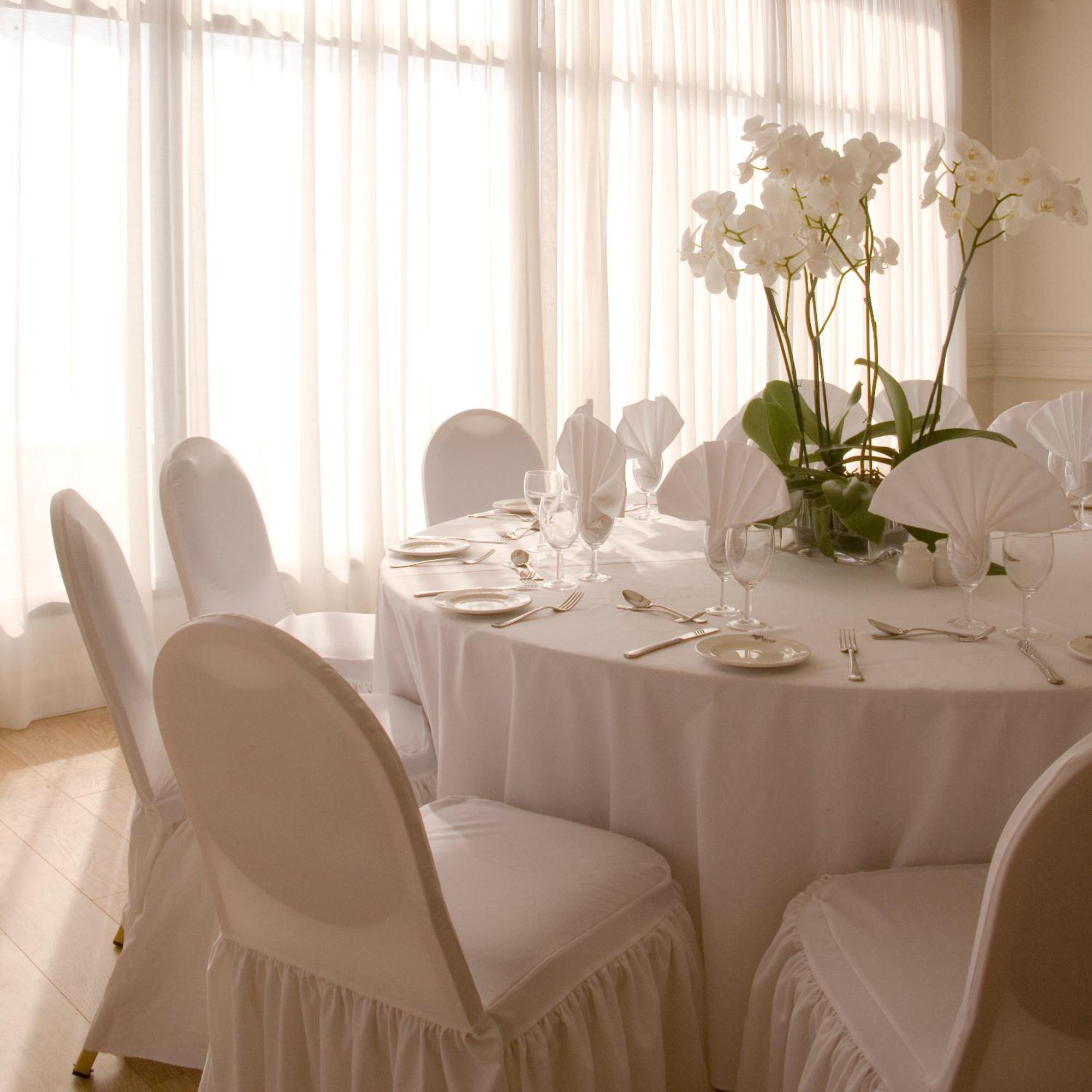 Venus Beach Hotel Paphos Exterior photo A table set for a formal dinner