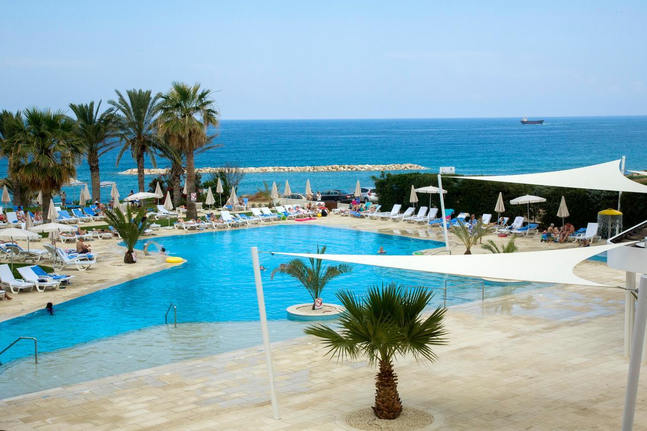 Venus Beach Hotel Paphos Exterior photo A swimming pool at a hotel in Cyprus