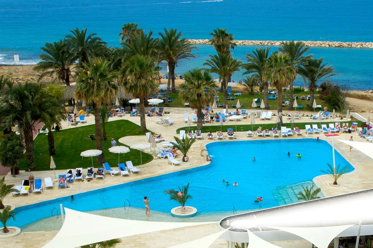 Venus Beach Hotel Paphos Exterior photo A swimming pool at a hotel in Cyprus