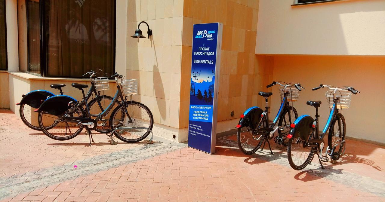 Venus Beach Hotel Paphos Exterior photo Bicycle rental at the airport