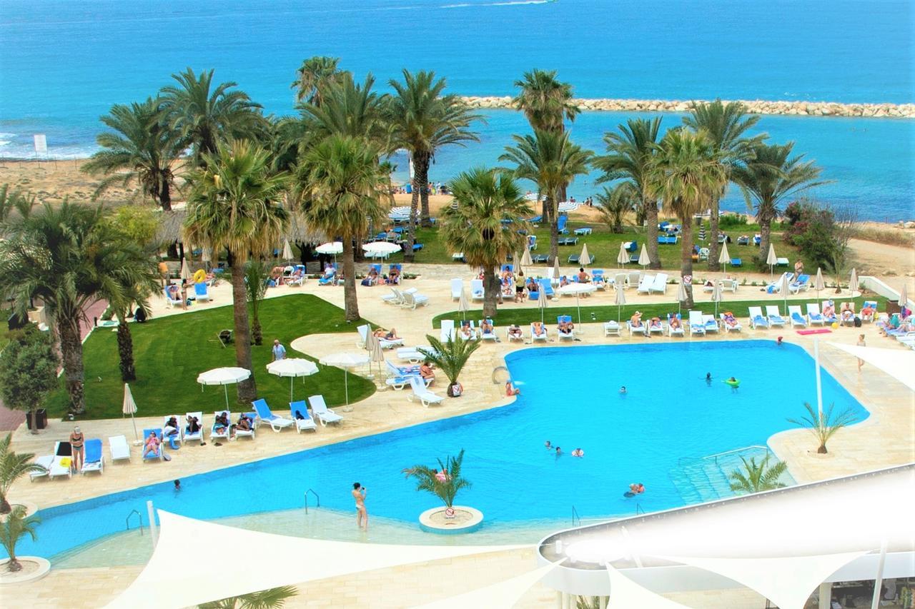 Venus Beach Hotel Paphos Exterior photo A swimming pool at a hotel in Cyprus