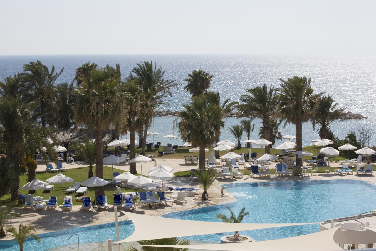 Venus Beach Hotel Paphos Exterior photo A pool at a hotel in Cyprus