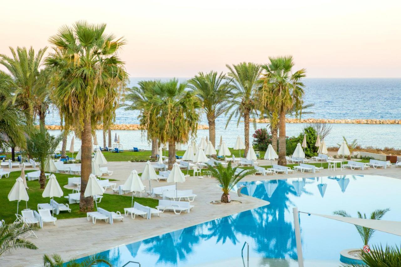 Venus Beach Hotel Paphos Exterior photo A pool at a hotel in Cyprus