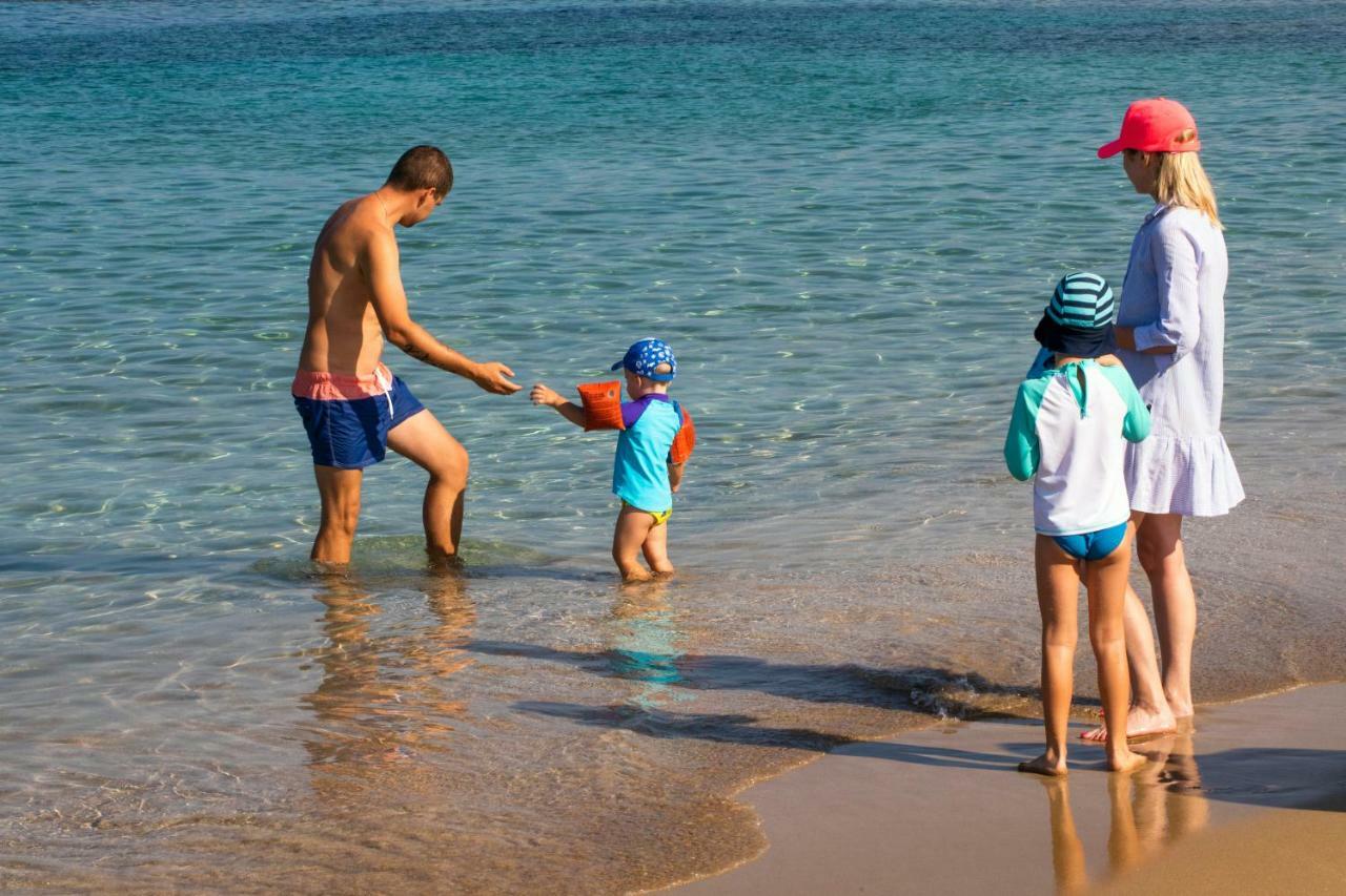 Venus Beach Hotel Paphos Exterior photo Family on the beach